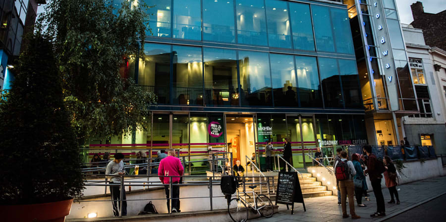 Image depicts an exterior shot of Broadway Cinema in the evening.