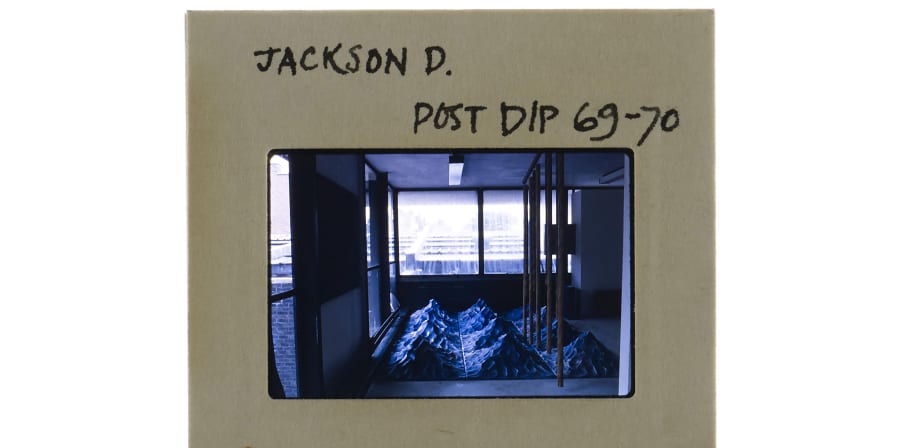 35mm colour slide of degree show installation of sculpture constructed of twelve pyramid like peaks in a water like texture. Annotation on slide mount 'Jackson D. Post Dip 69-70'. Date stamp 'Jul 70'.    