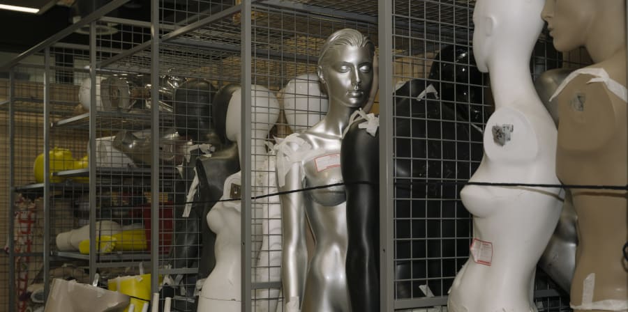 Various mannequins in a room.