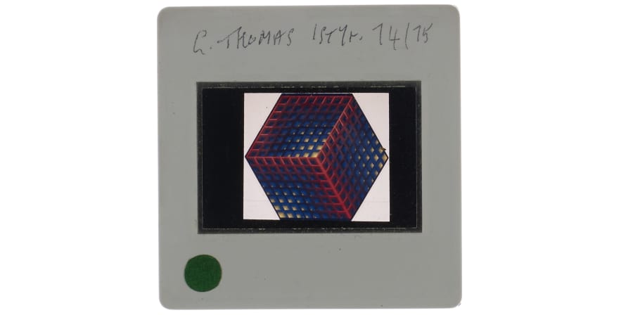 35mm colour slide of print of 3D cube constructed of smaller blue, red and yellow cubes. Annotation on slide mount 'G. Thomas 1st yr. 74/ 75'. 