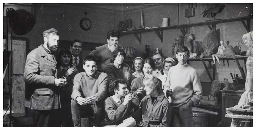 Black and white image of group of students in a studio