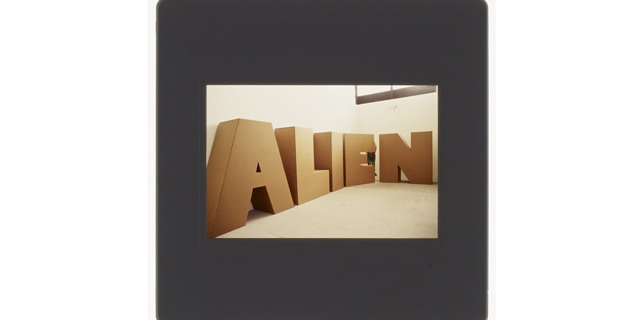 35mm colour slide of degree show installation of large letters made from cardboard, spelling out the word 'ALIEN' 
