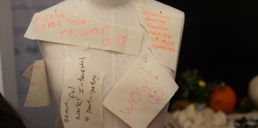 torso mannequin front view with handwritten post it notes
