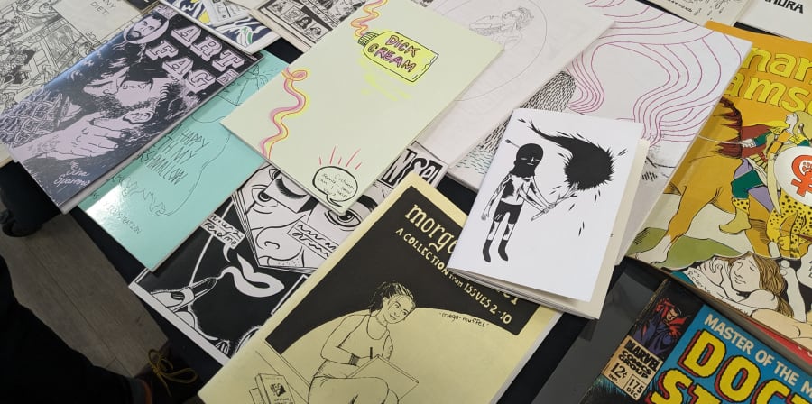 Close up of a display of zines on a table
