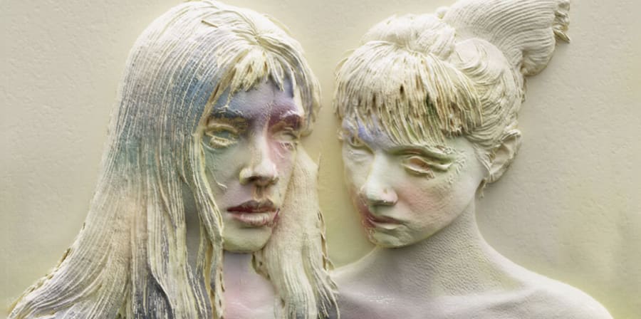 Editorial head and shoulders shot of 2 subjects who appear to be chalk washed 