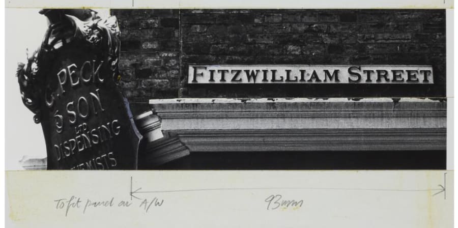 Black and white photograph of a road sign reading, Fitzwilliam Street, the photograph is cropped and mounted on a white background with notes in pencil around it.