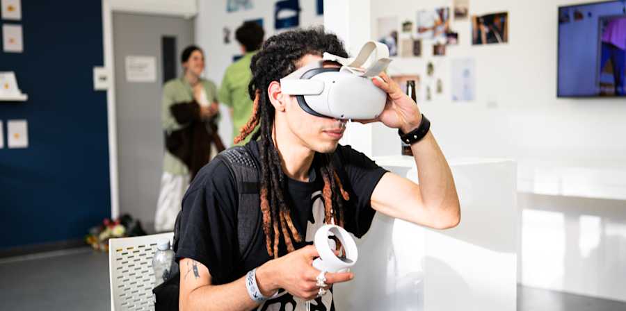 A student looks through a VR headset 