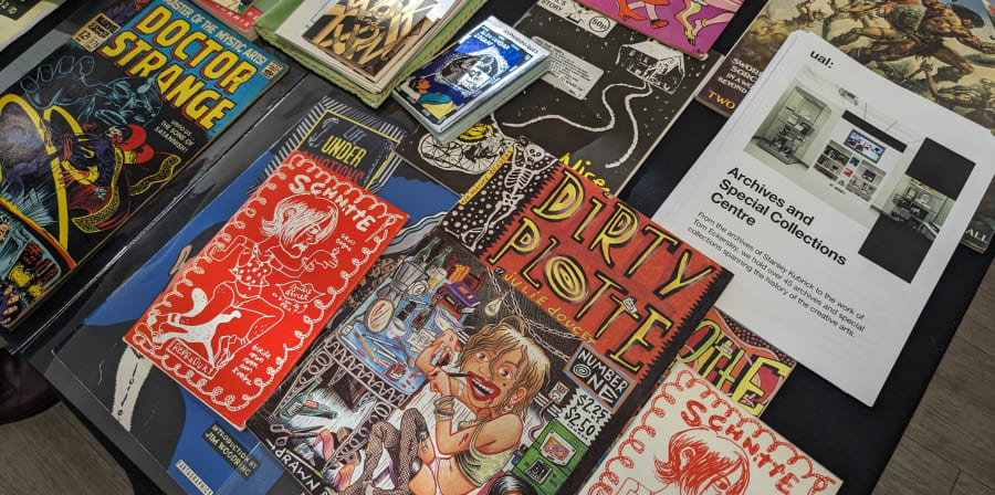 Close up of limited edition comics and zines displayed on a table