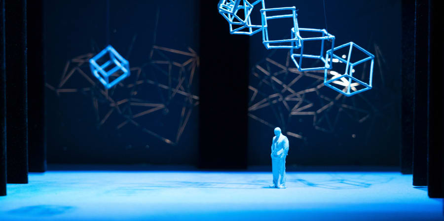 A shot of a room filled with giant plastic bubble, there are hues of blue and red lighting