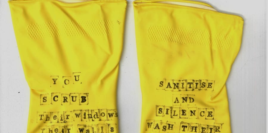 photo of a set of yellow marigold cleaning gloves with words on them