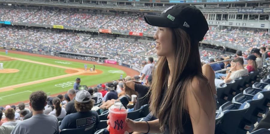Student at a baseball game.
