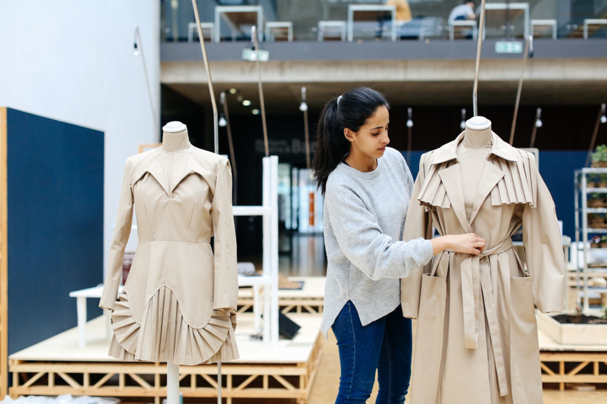 Naila Al-Thani and her 2 fashion design garments without stitches