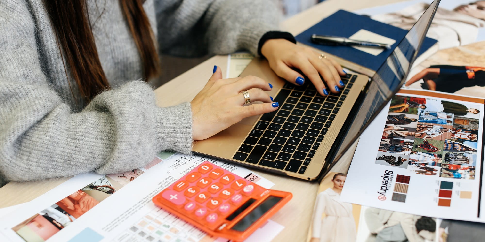 Student using a laptop and a calculator