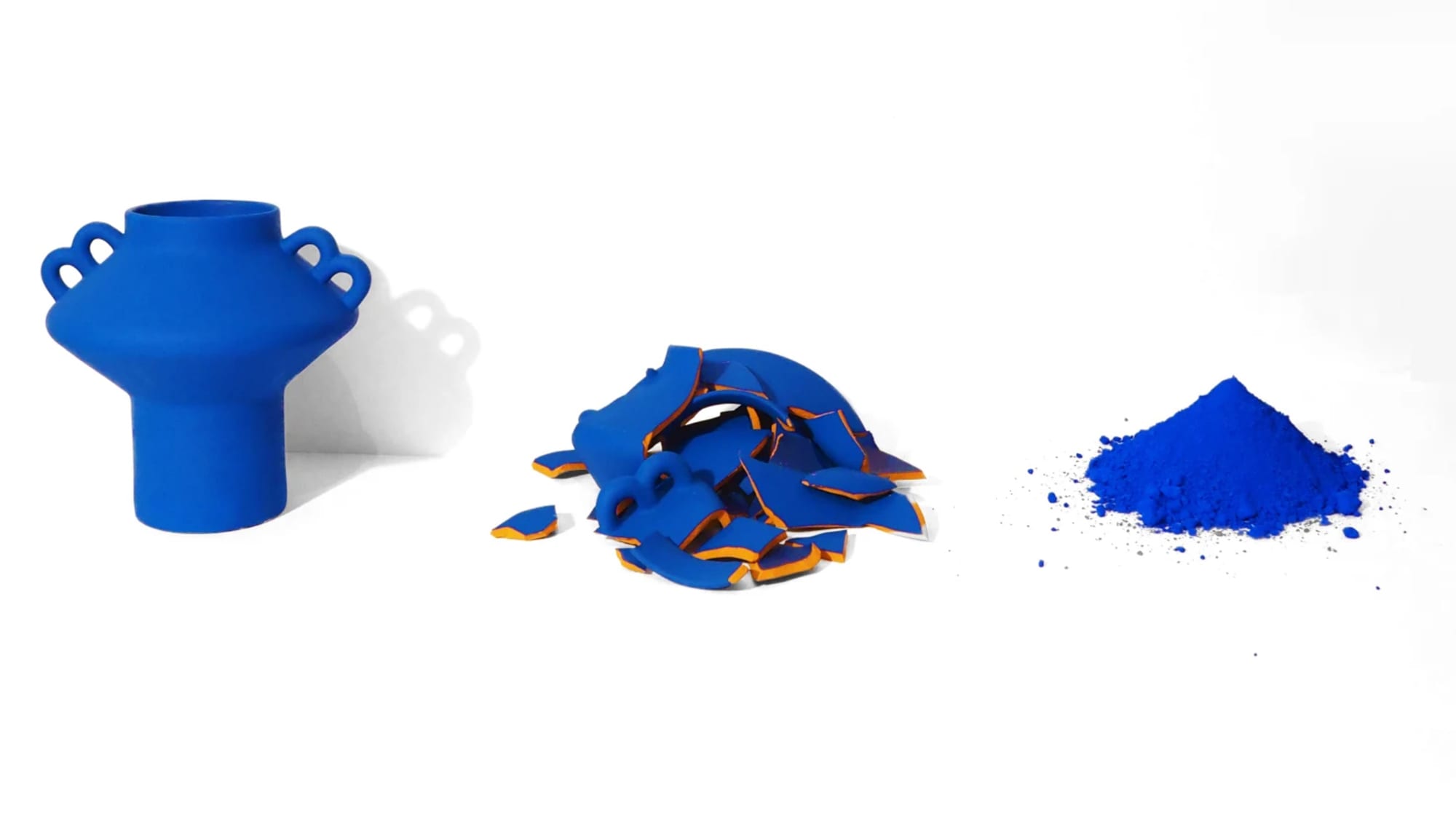 Three broken blue ceramic vases 