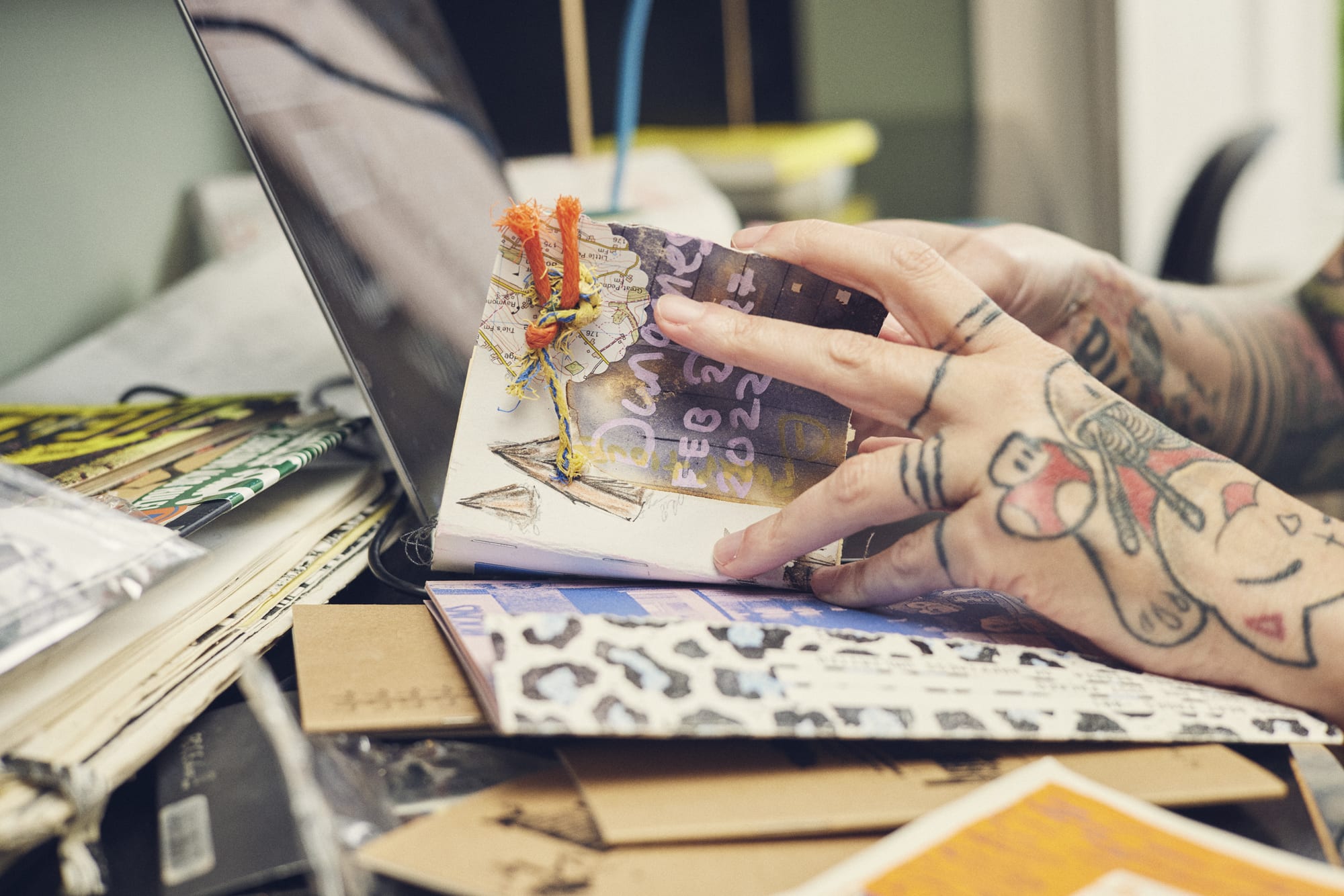 Looking through a zine for an online zine making course by Ben Turner