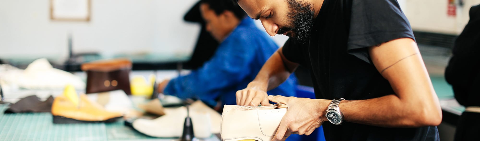 Photo of a man making shoes