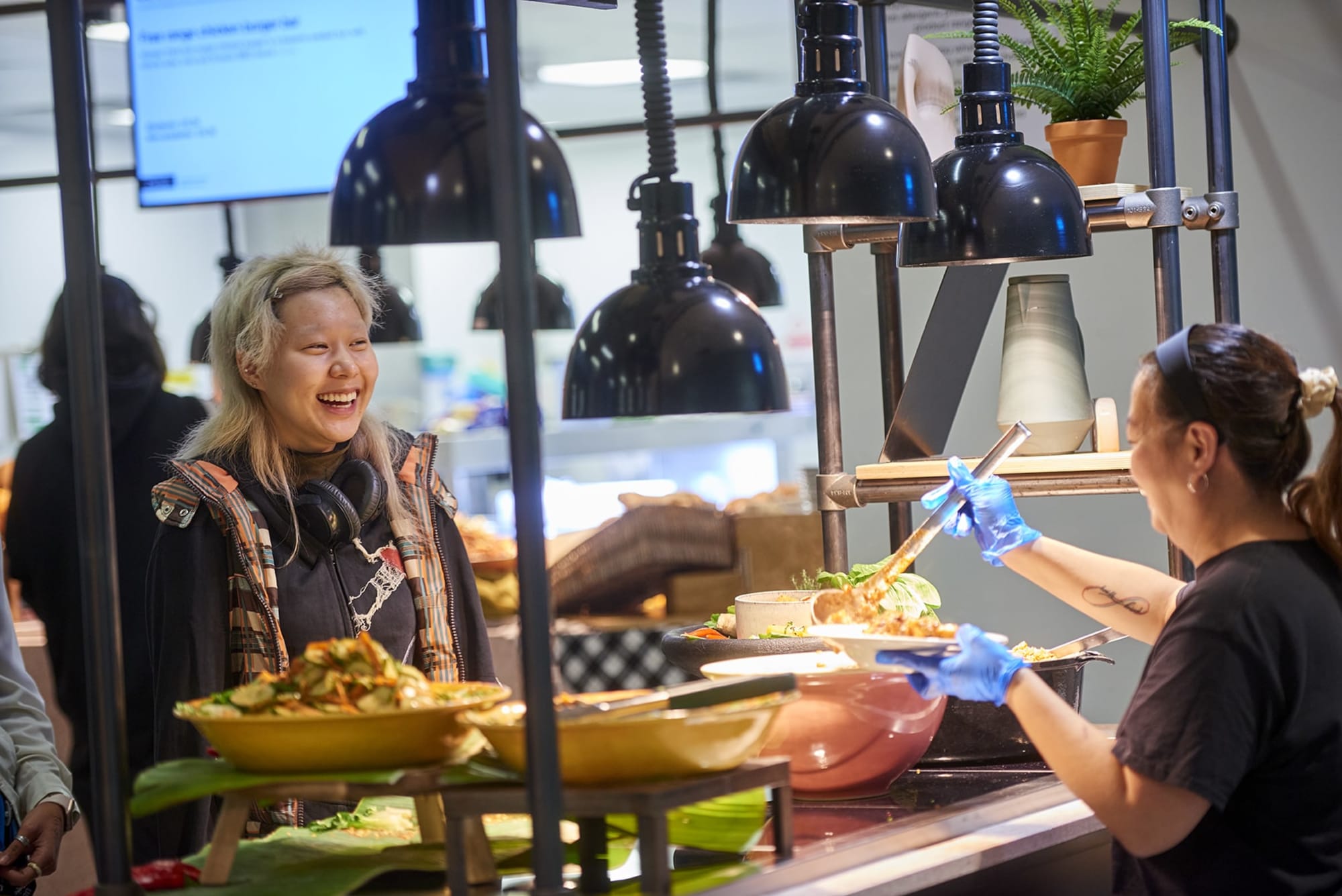 Two people in UAL King's Cross Canteen