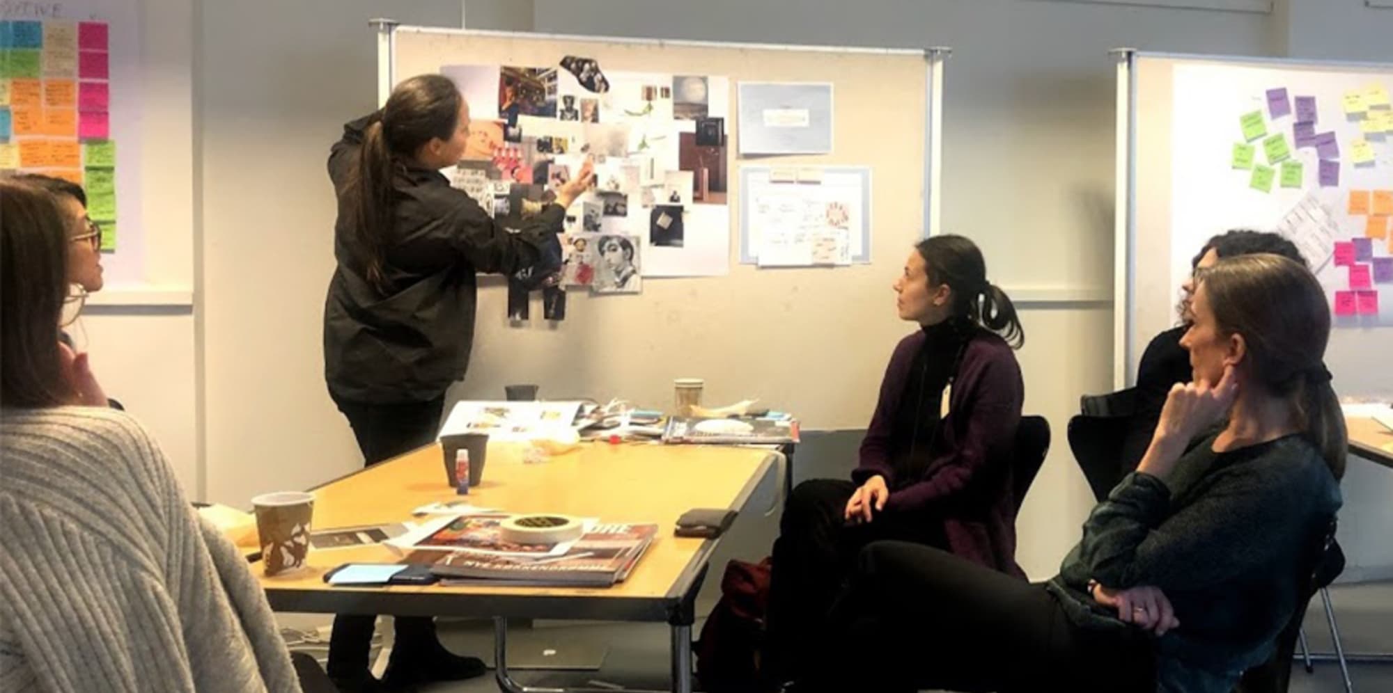 People in class listening to a presentation