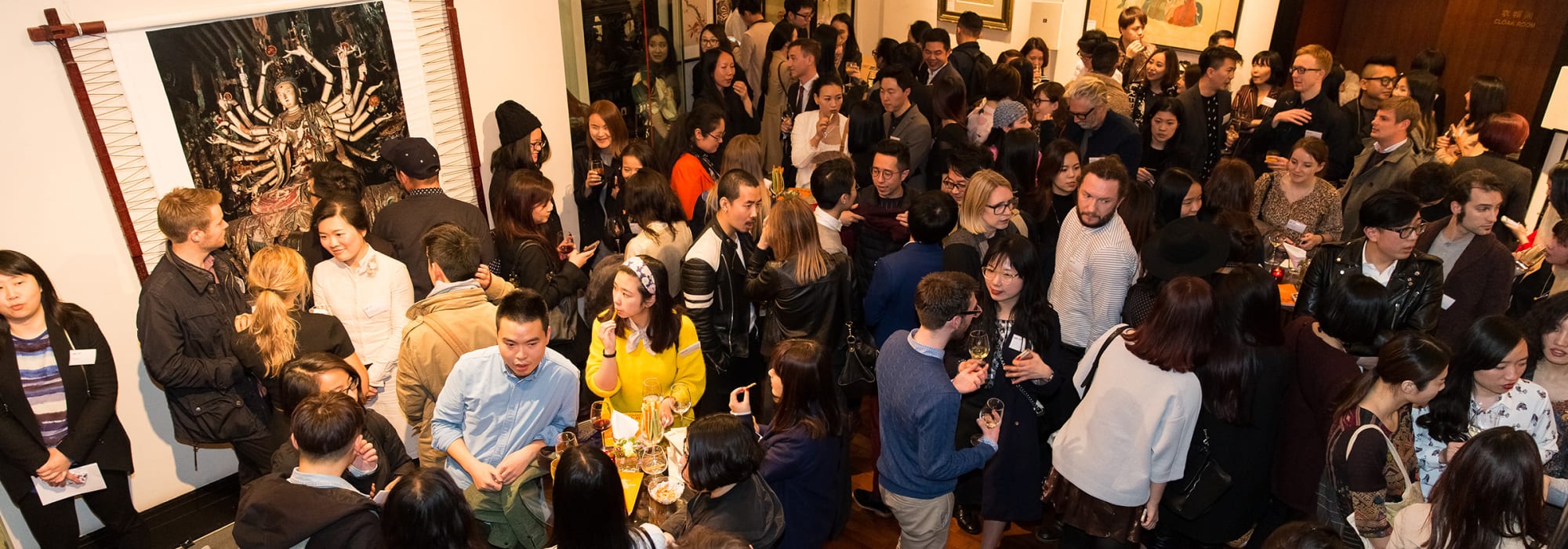 Room of people chatting in groups