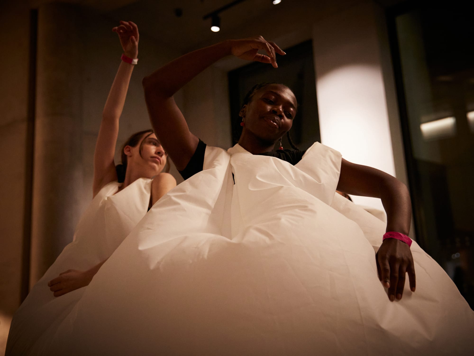 Dancers in inflated dresses.