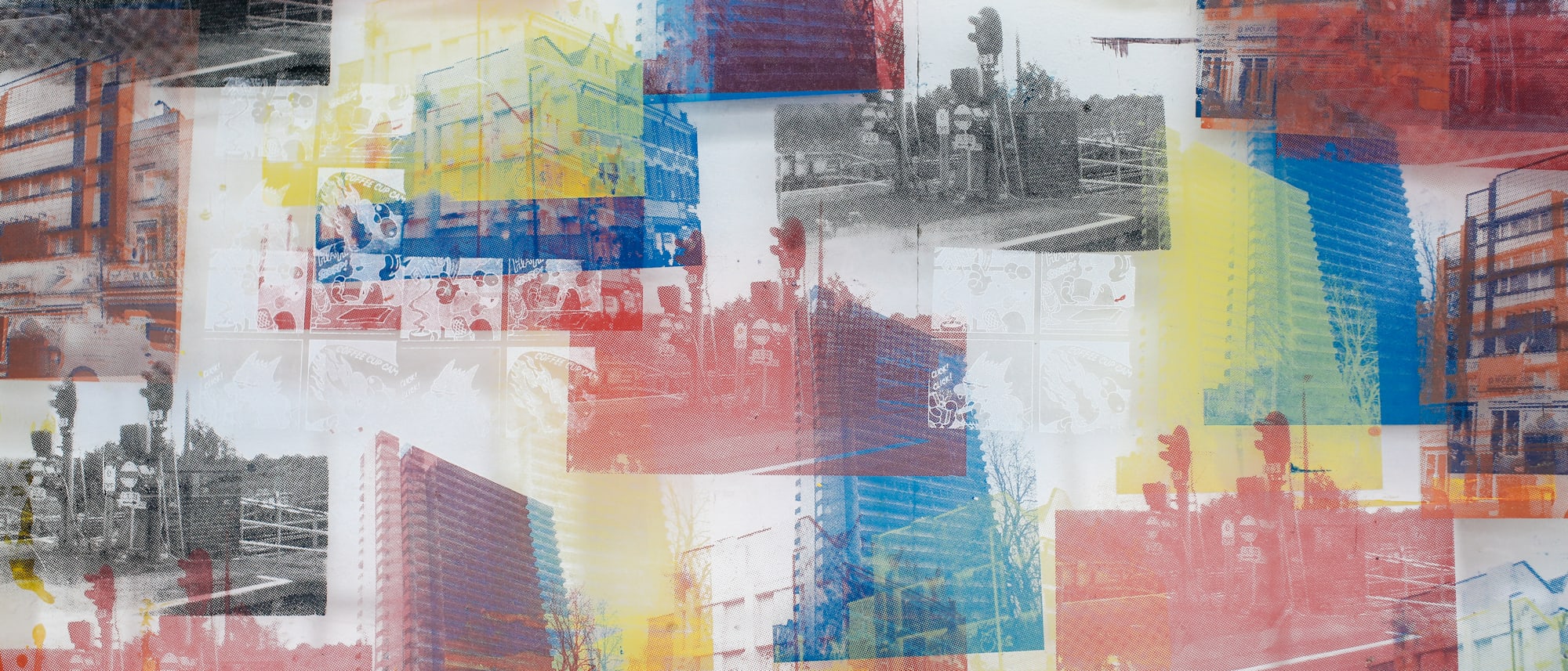 Screenprint of buildings in grey, red, yellow and blue