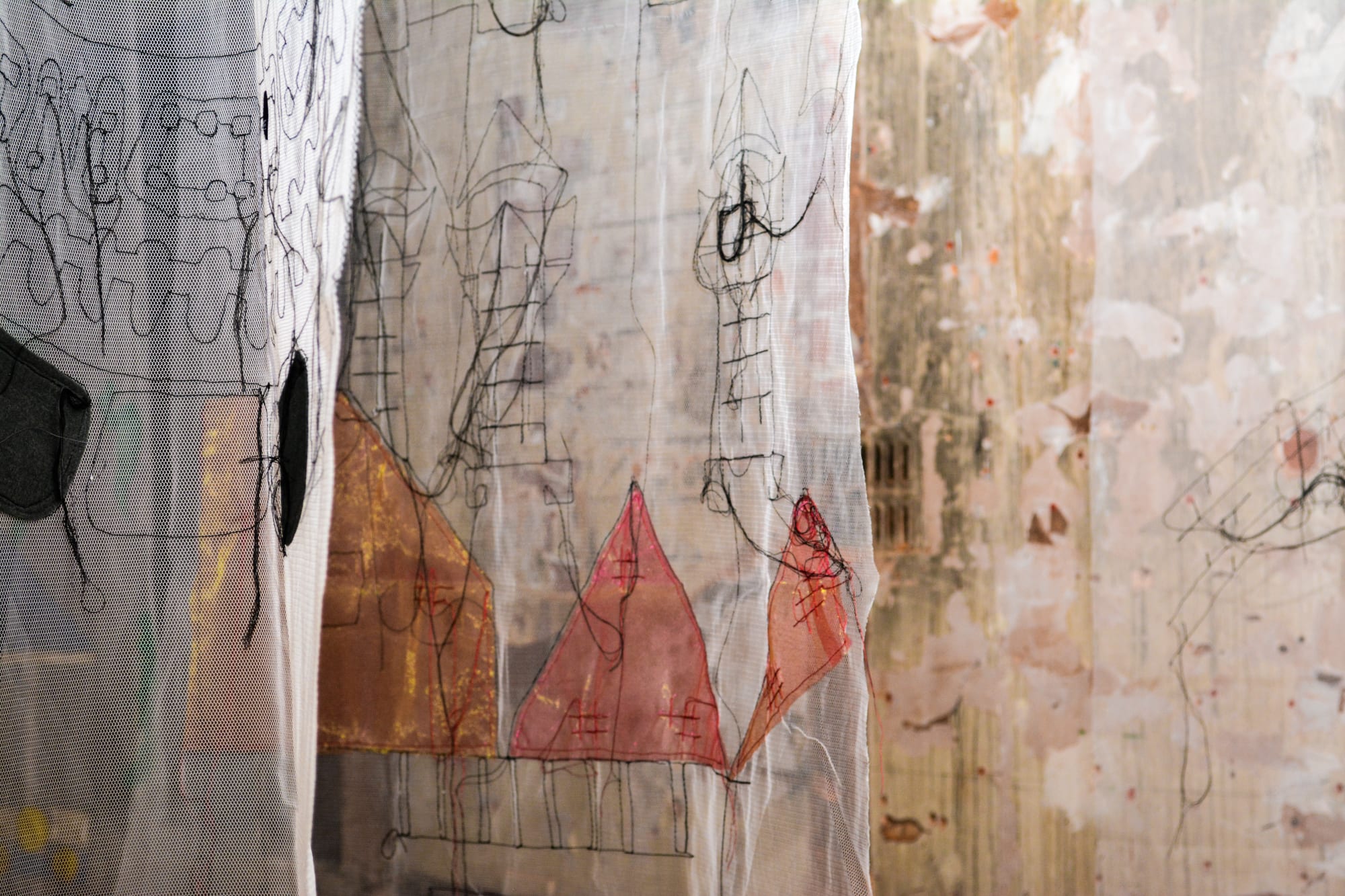 Hanging colourful embroidered fabrics