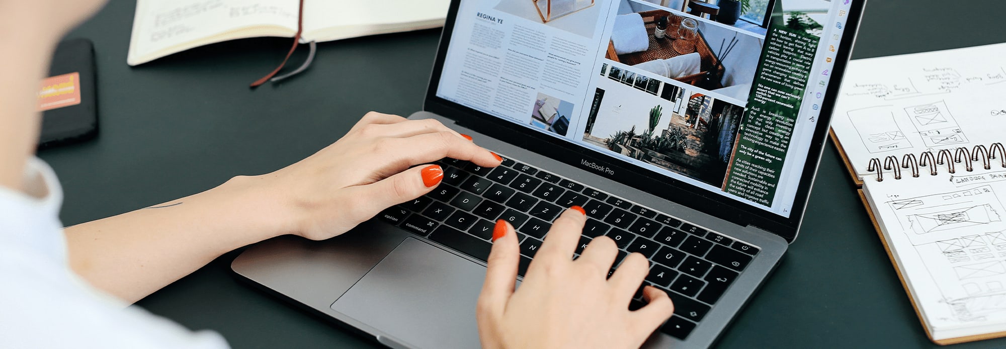 Close up photo of hands typing on a laptop