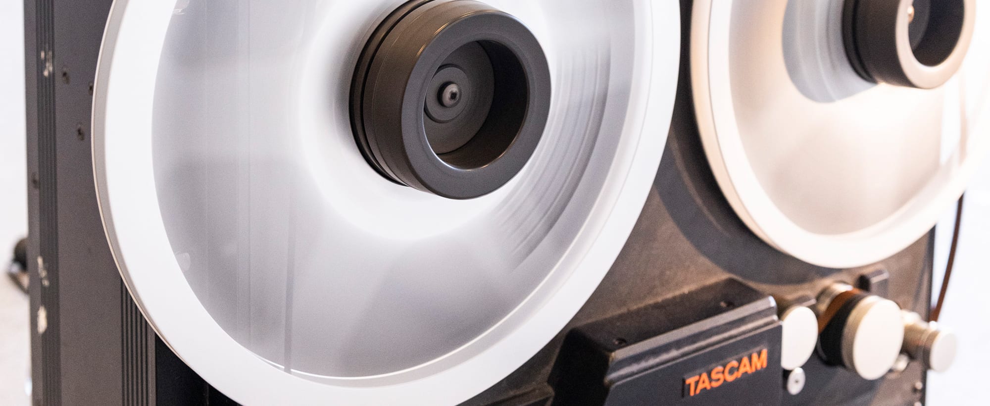 A close up of a Tascam reel to reel tape recorder.