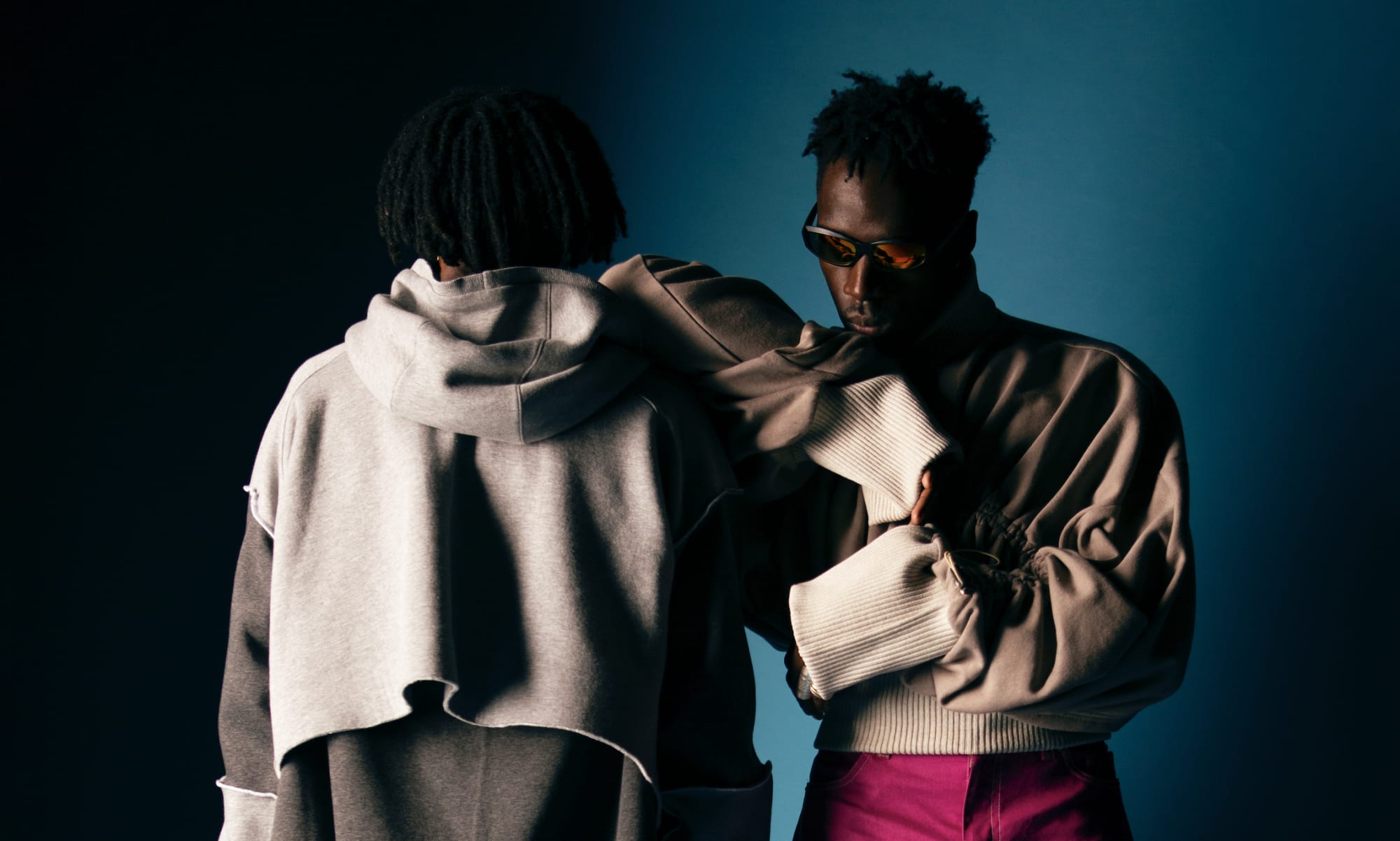 Two black men in embrace.