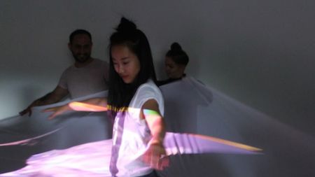 Model combining costume, dance and technology in student work