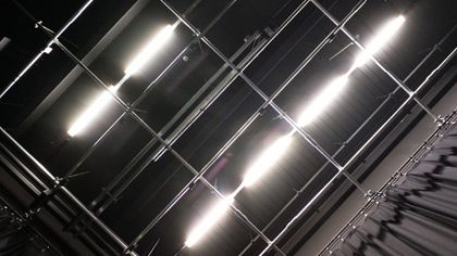 Photograph of large bright lights on the ceiling backstage of the Black Lab at Central Saint Martins