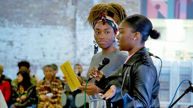Two black female speakers at the CSM Zine 1 launch at UAL in 2019