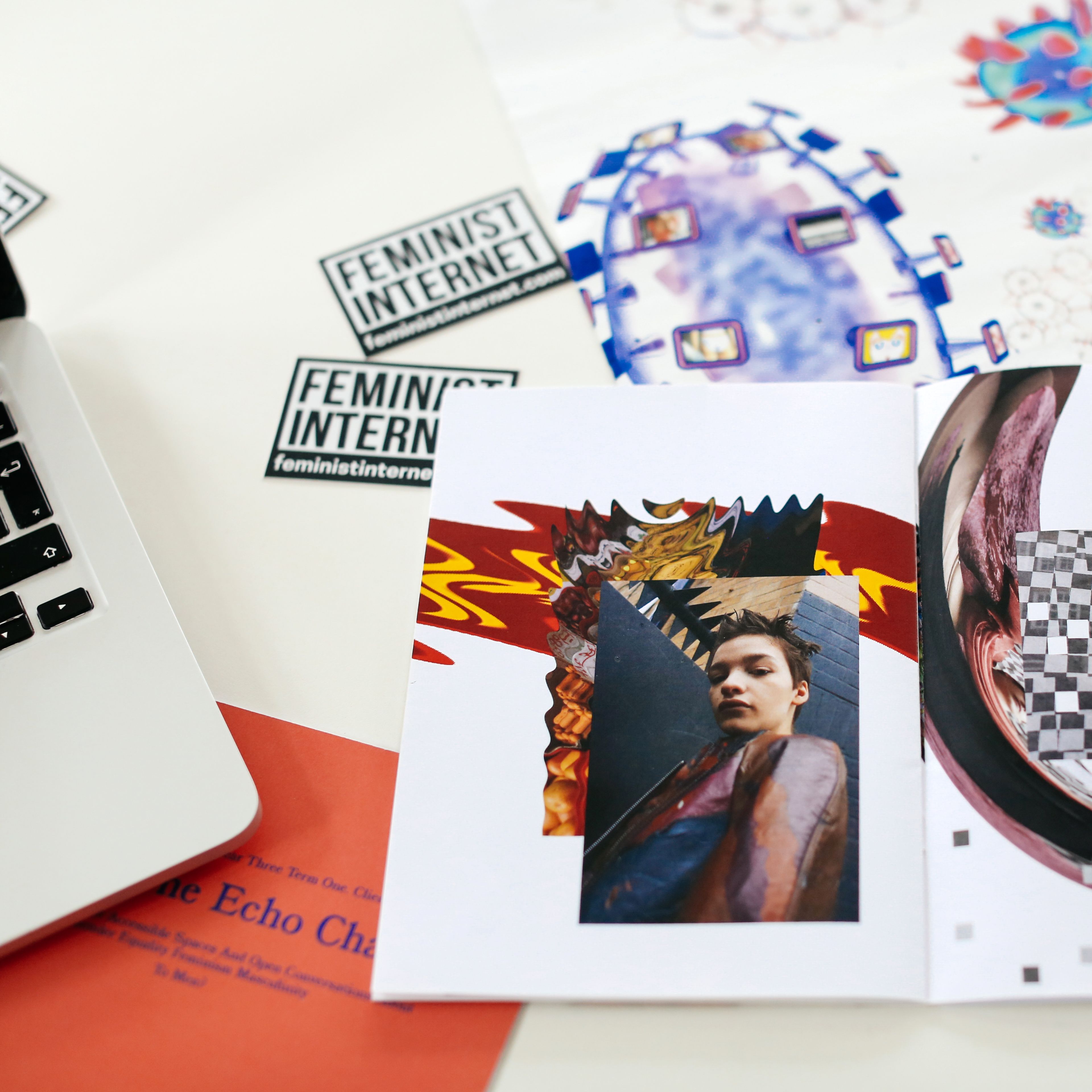 Open sketchbook on a table next to a laptop, MA Fashion Media Practice and Criticism (now MA Fashion Communication: Fashion Critical Studies), Collage by Clara Finnigan, Copyright holder: Alys Tomlinson 