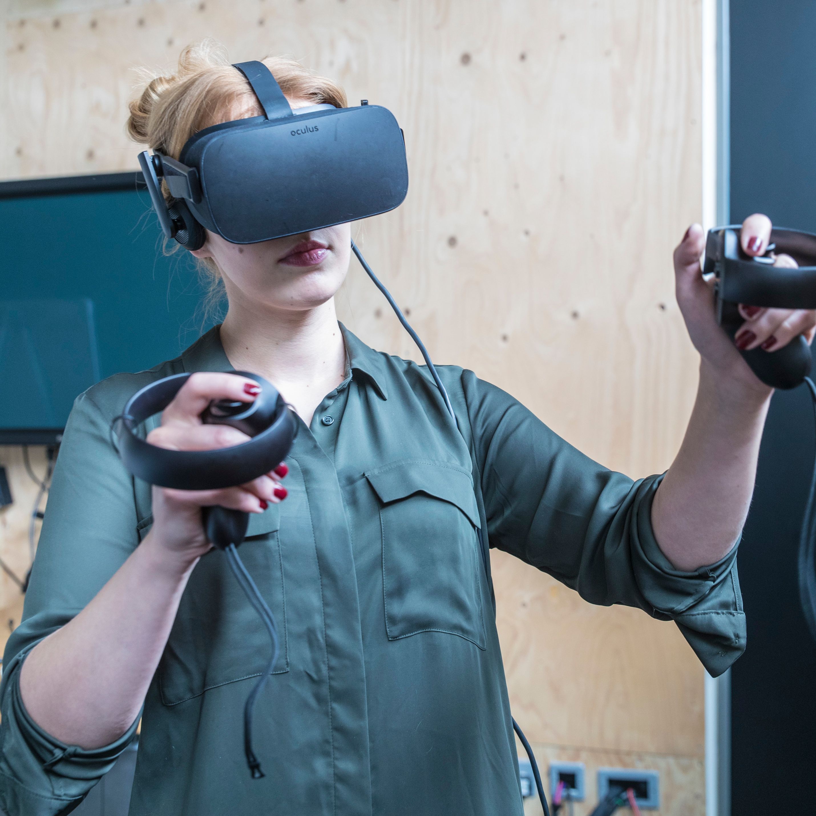 A person using a VR headset and controls