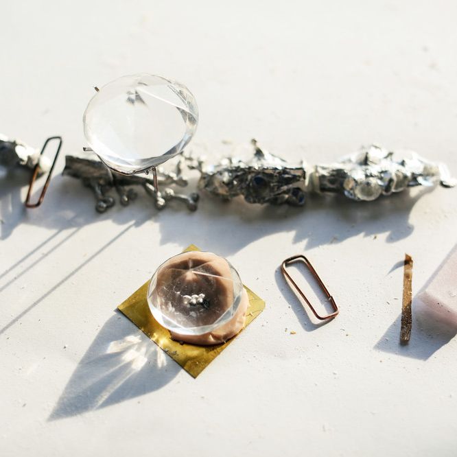 Two crystals and abstract metal items 