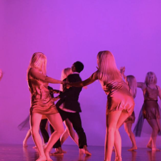 Pink-light in space with dancers