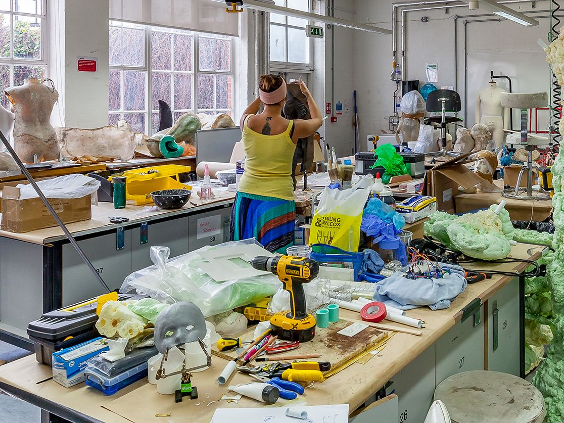  Student from the BA (Hons) Hair, Make-up and Prosthetics for Performance at LCF working on a clay cast. 