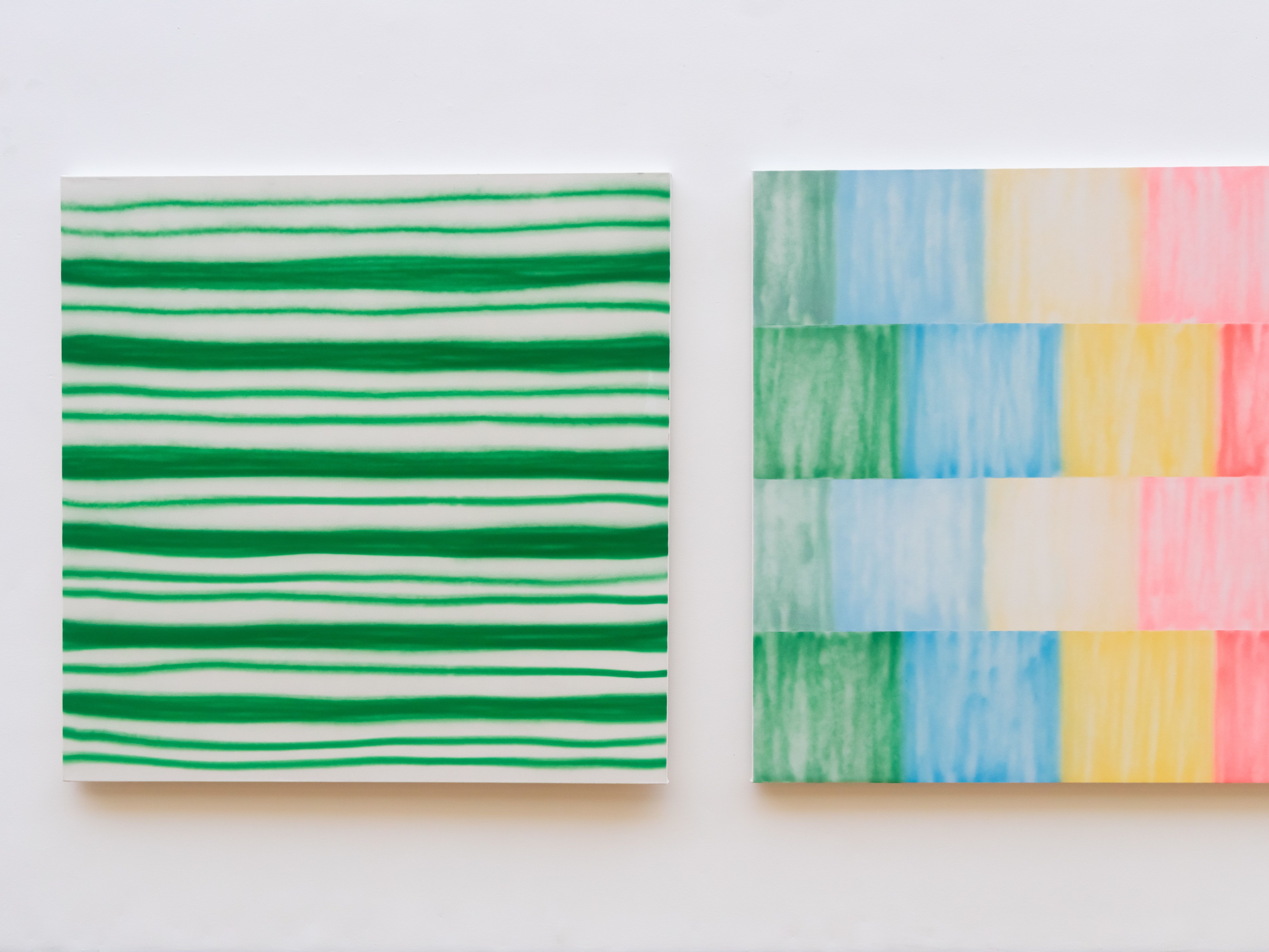 Two square paintings side by side
