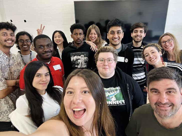 A group poses together for a selfie