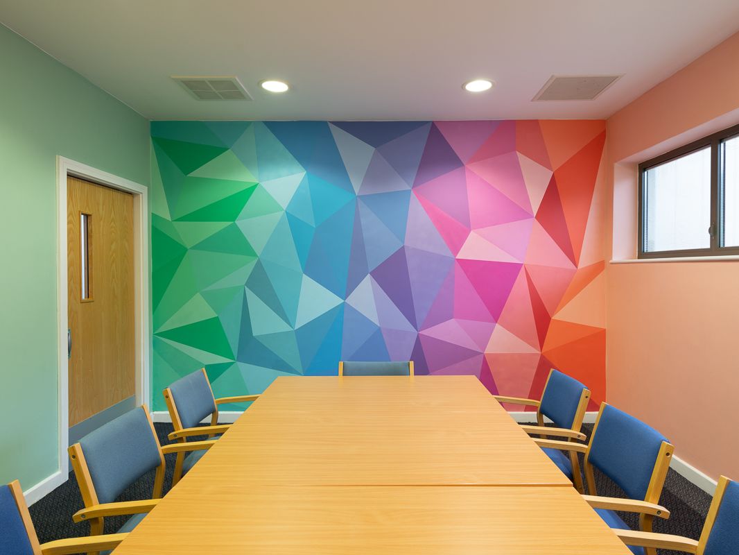 Charley Peters' colourful artwork on display in the Tribunal Room at Bluebird House.