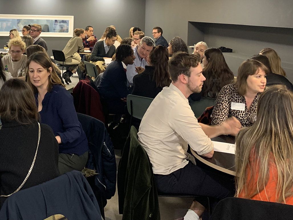 Students and guests chat over tables in LCC's Typo Cafe.