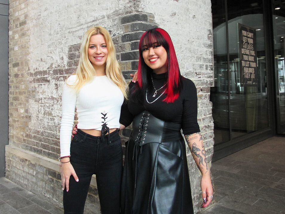 Photograph of 2 people smiling.