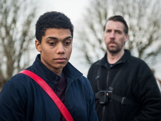 Still from the film Killed by my Debt, featuring the main and supporting character