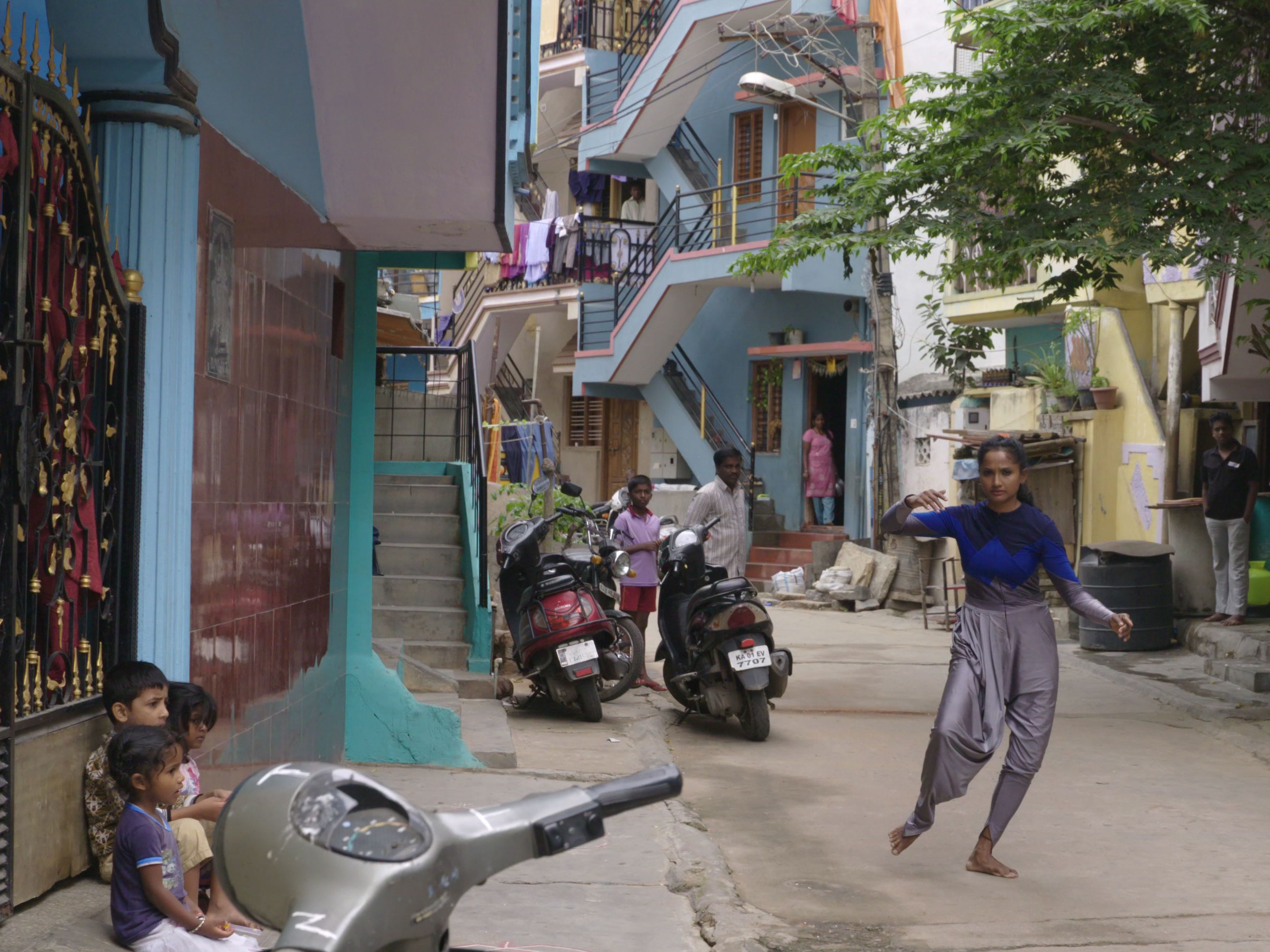 Dancer from the film A Small Dream, dancing in an Indian street. 