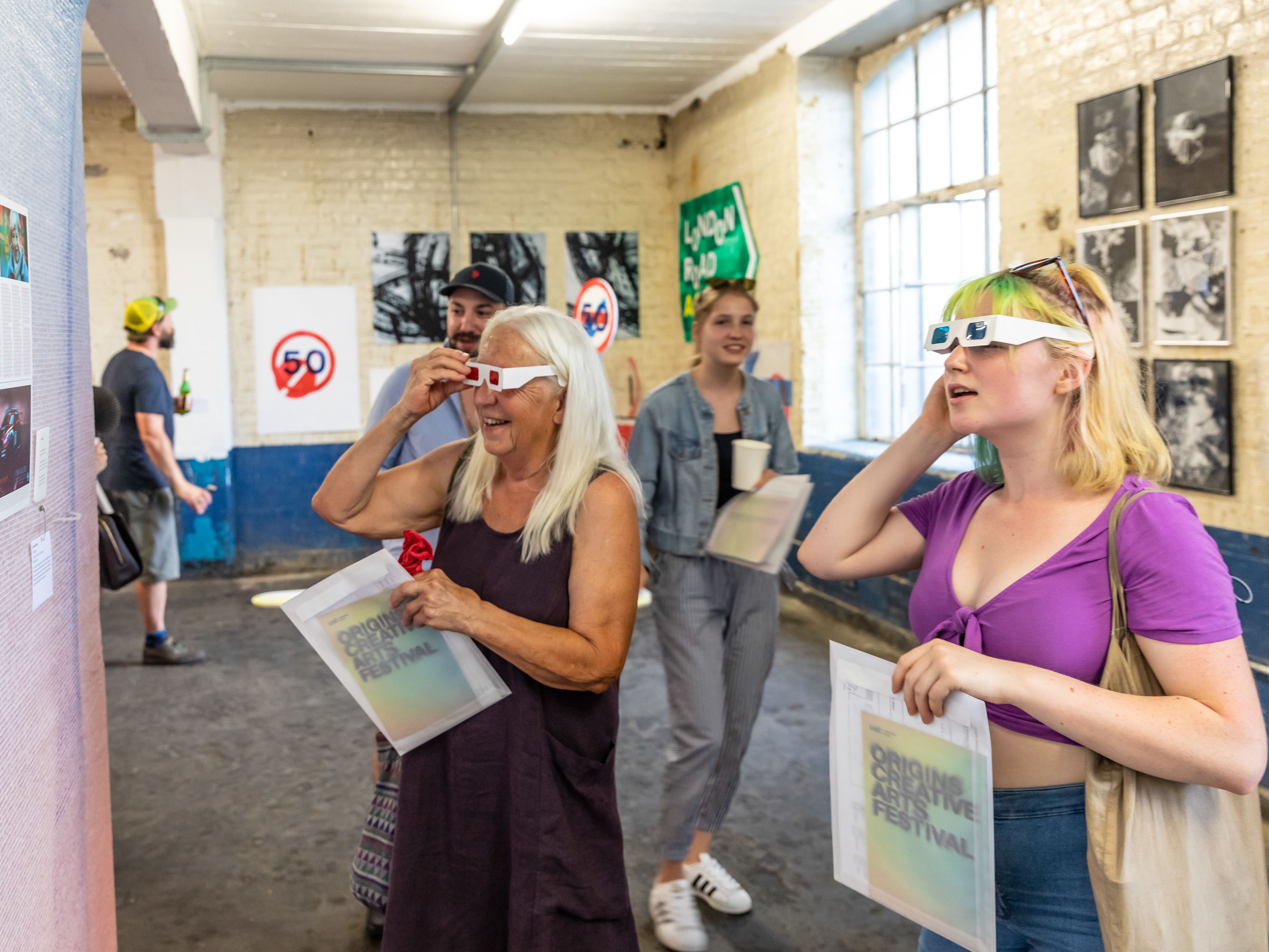 People engaging with artwork at Origins Creative Arts Festival 2019