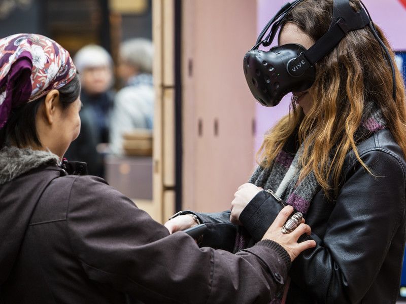 People using VR headsets at Fashion Means Business 19 by Fashion Innovation Agency at Spitalfields Market. Photography, Katy Davies.