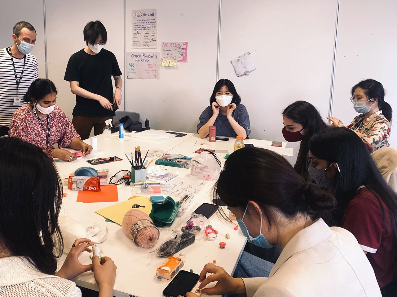 A group of students sit around a table.