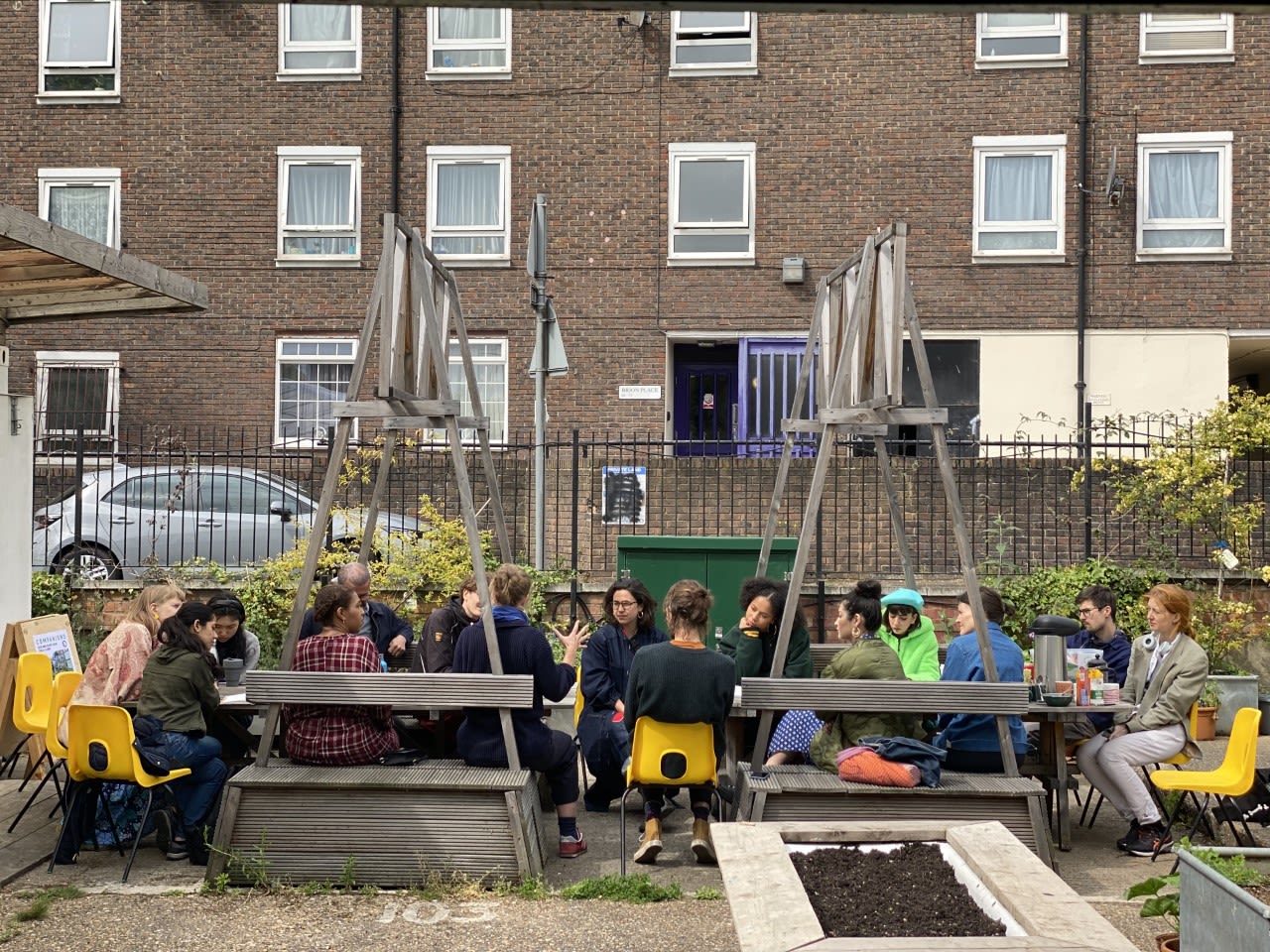 Students sitting around a picnic table outdoors