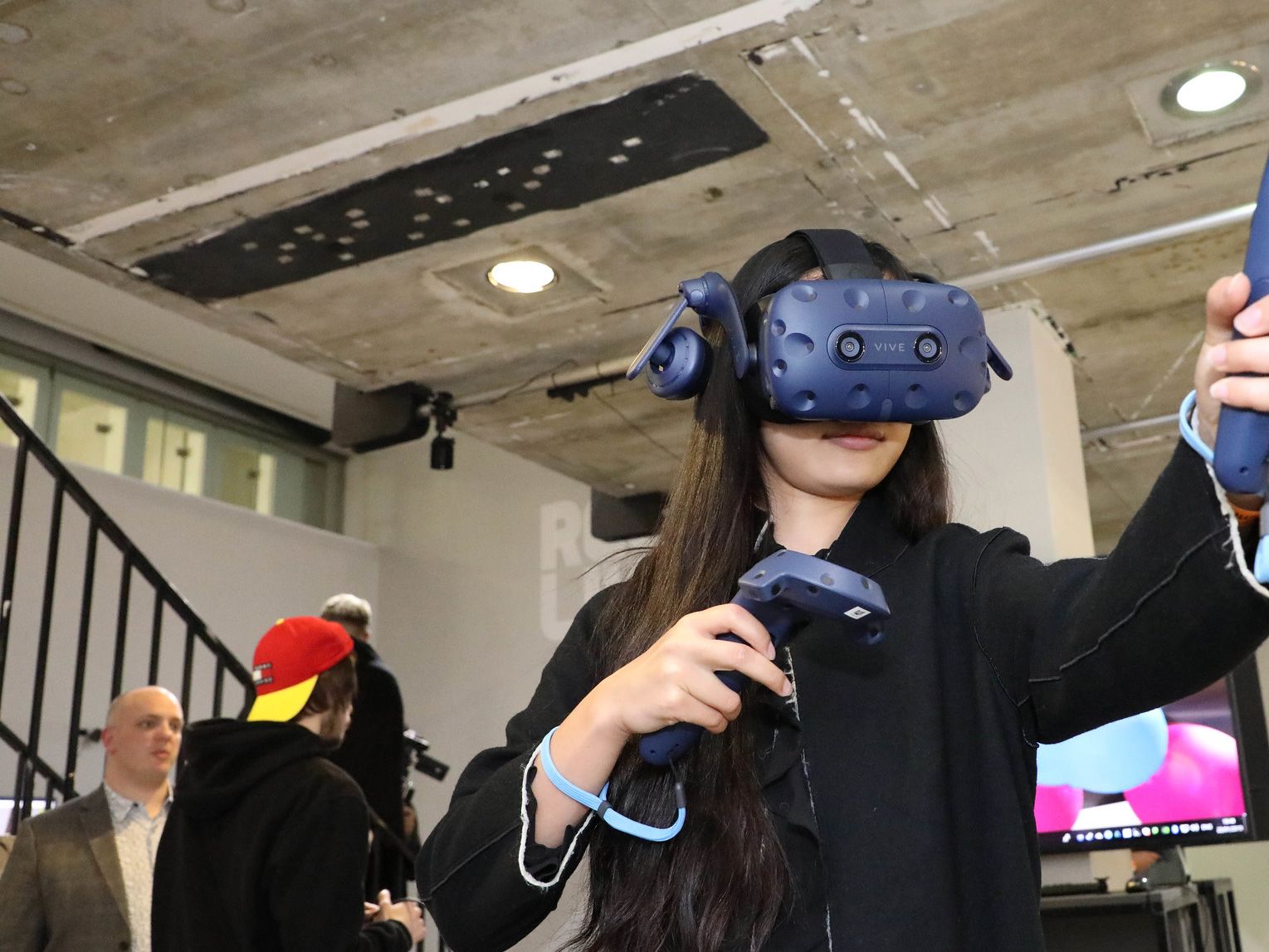 Woman wearing VR headset pointing