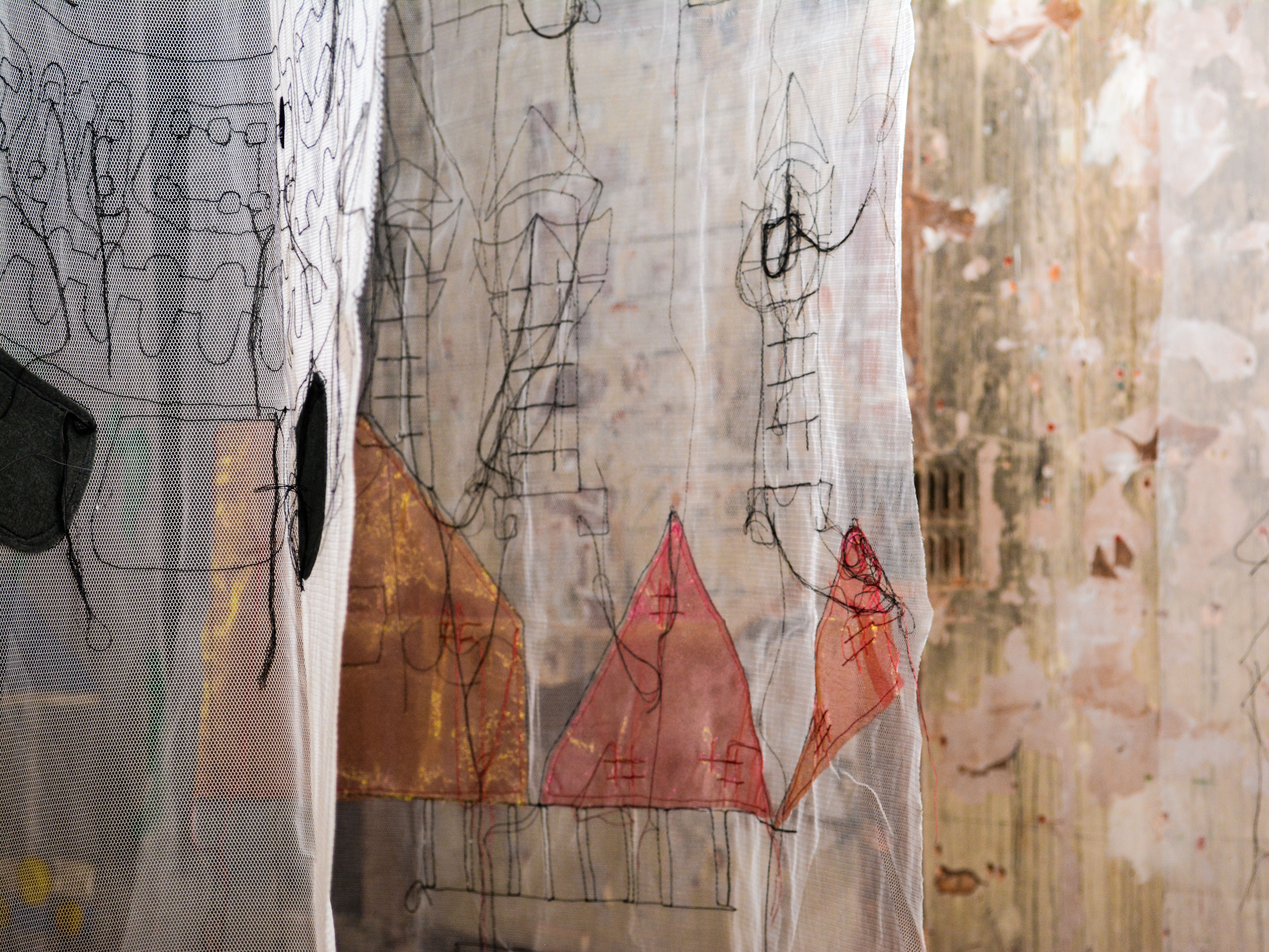 Hanging colourful embroidered fabrics